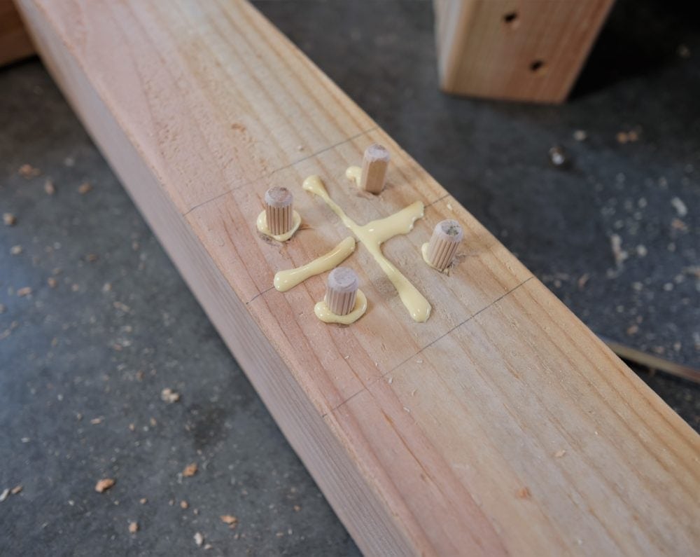 Wood Dowels and wood glue in 2x4 to build rustic coffee table