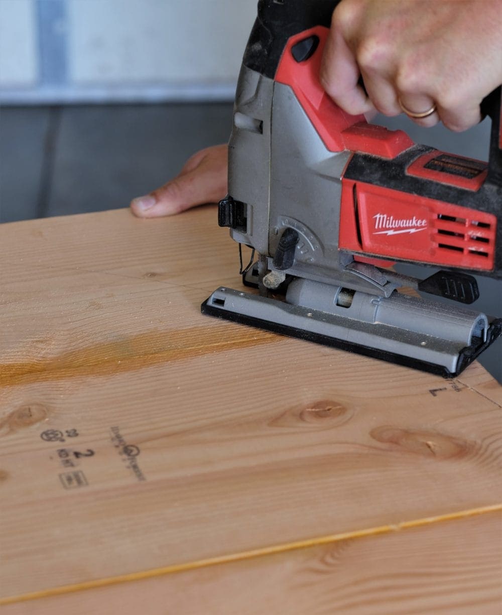 Man using Milwaukee Jig Saw making rustic coffee table