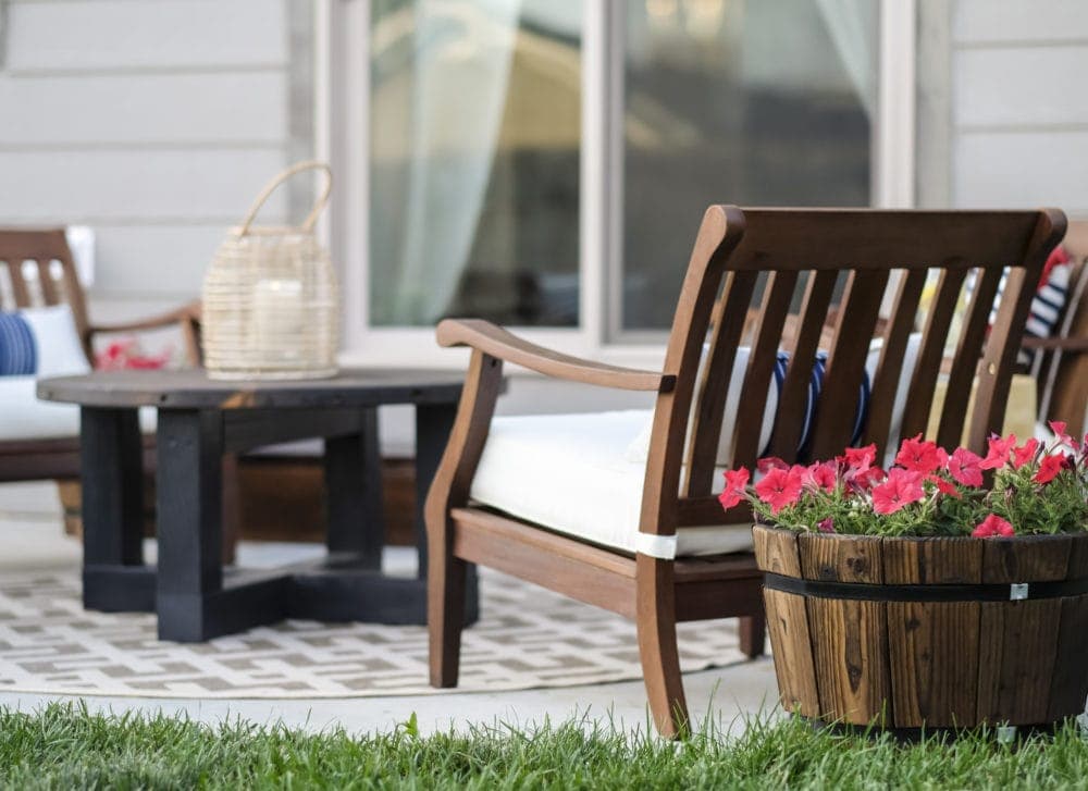 outdoor patio with flower pots and string lights