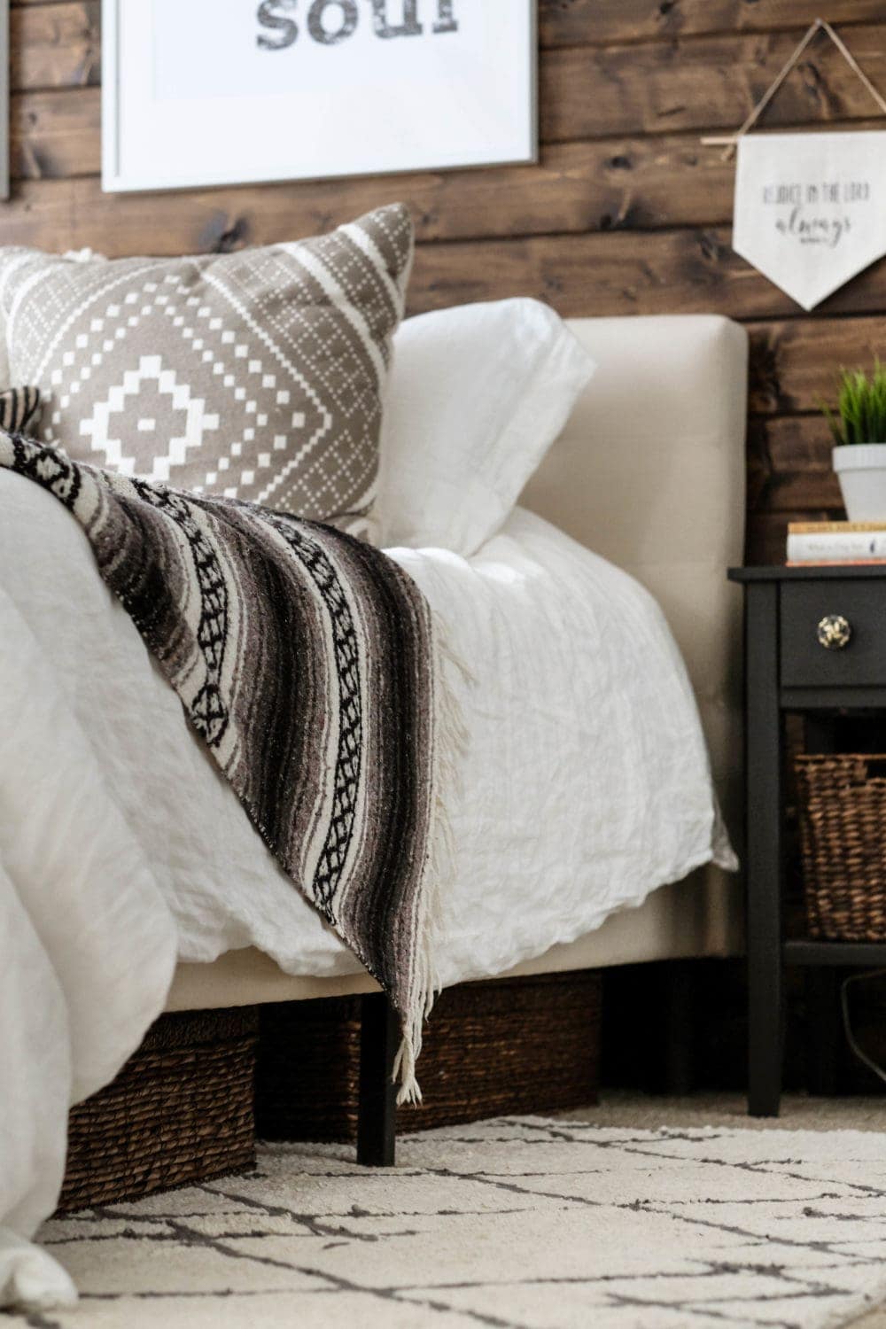 bed with wicker basket storage underneath 