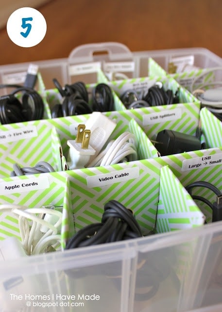 Cords and cables stored in an ornament organizer box with labels