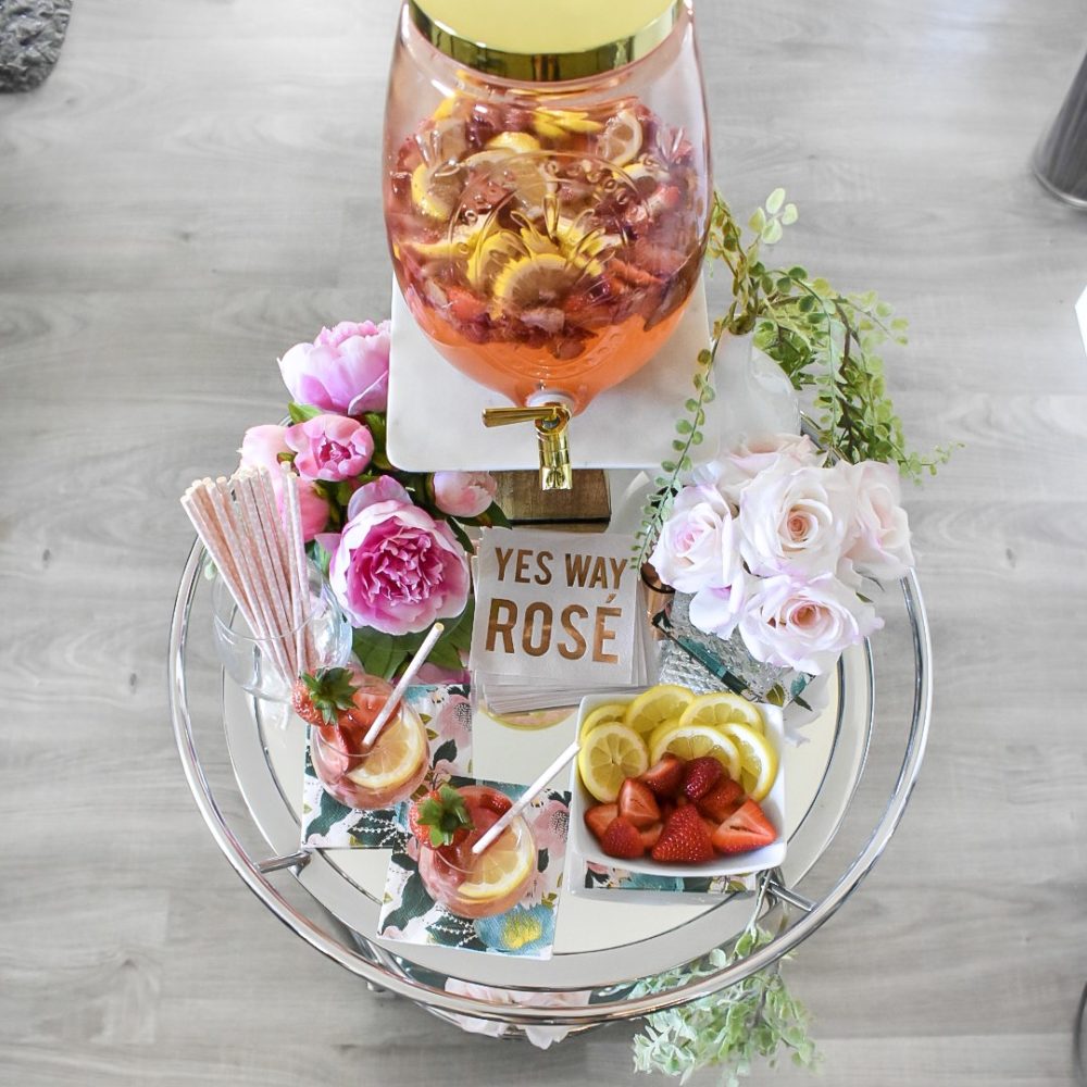 Overhead view of summer bar cart with strawberry lemonade sangria served for two