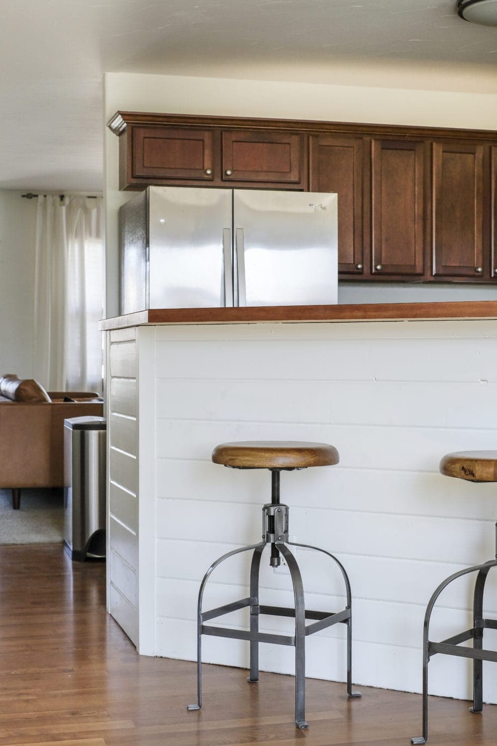 Budget kitchen breakfast bar with with DIY shiplap and rustic barstools