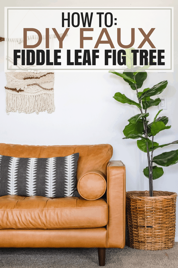 faux fiddle leaf tree standing next to leather couch