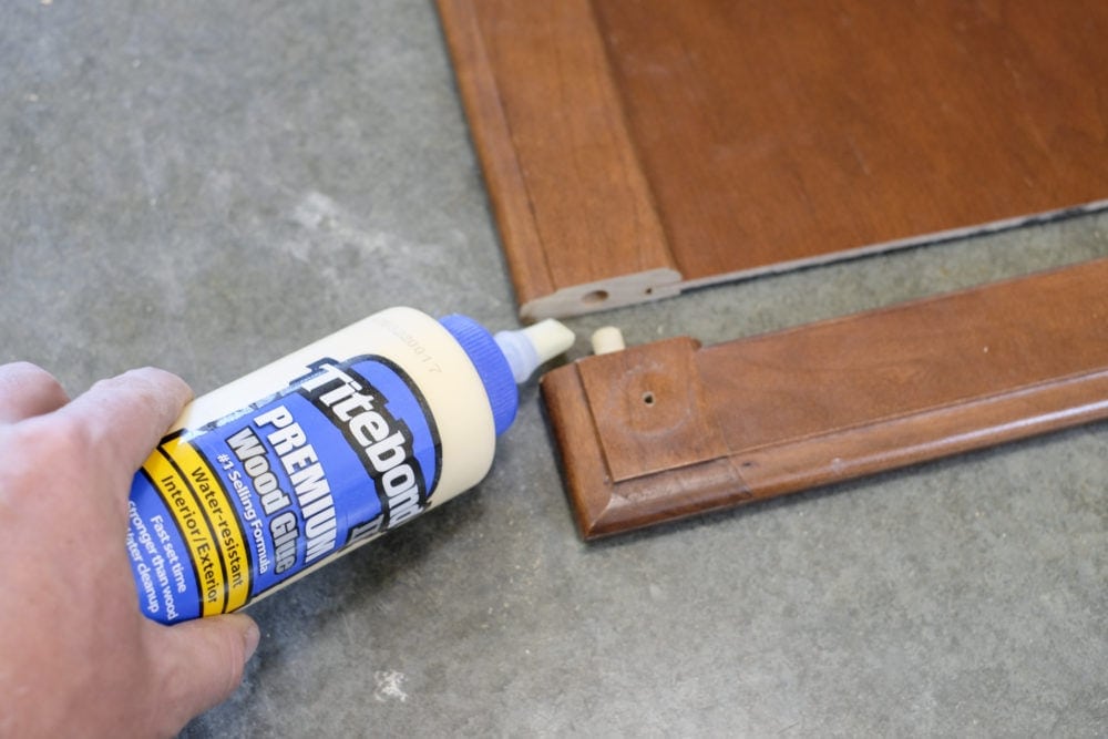 Wood glue gluing a cabinet door back together