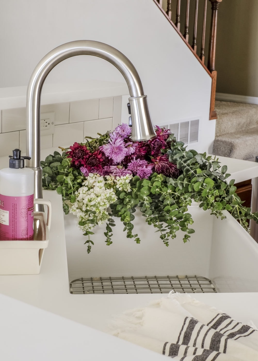 budget kitchen renovation after picture of a white farmhouse sink