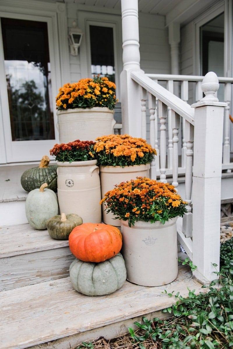 Fall front porch ideas using mums and old crocks