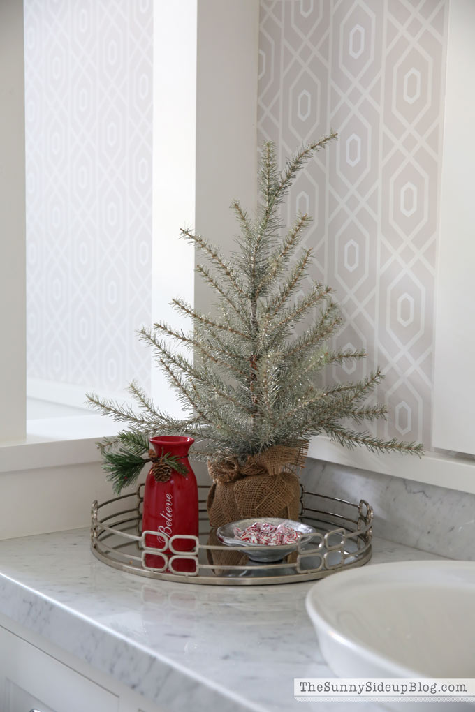 minimalist christmas decorations using a mini tree and a bowl of mints on a tray