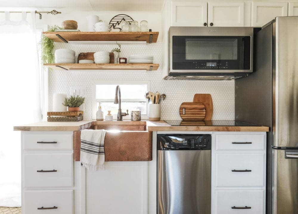 RV kitchen remodel with open shelving and stainless steel appliances