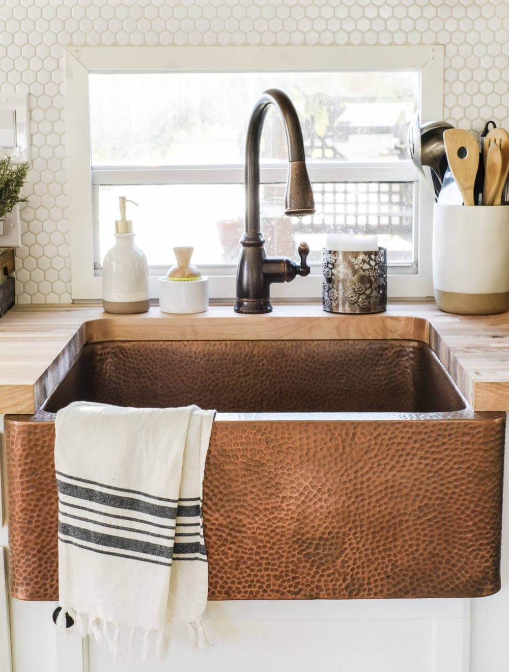 RV kitchen remodel featuring am apron front copper sink