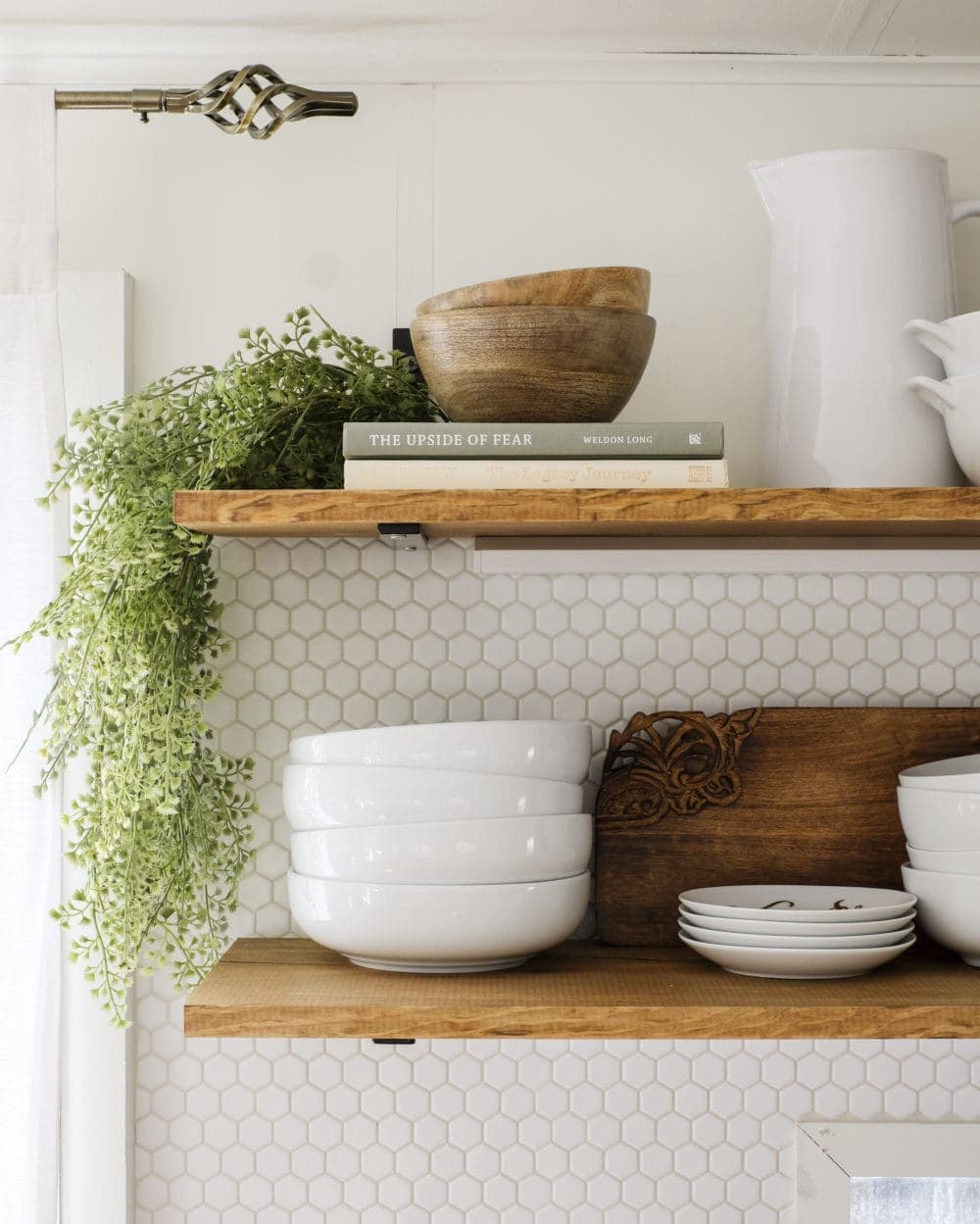 RV kitchen remodel with open shelving and hexagon tile backsplash