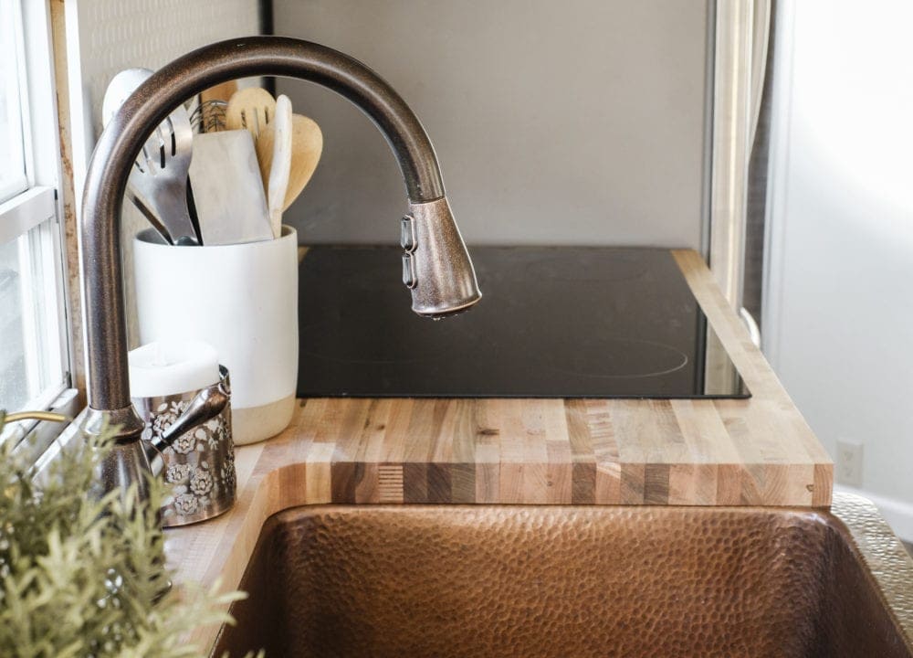 RV kitchen remodel with copper accents and butcher block countertops