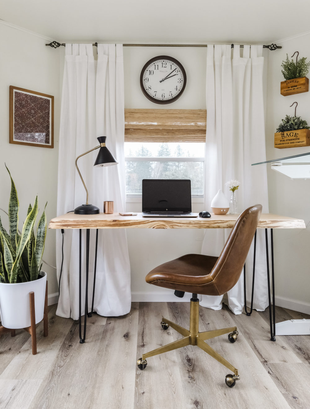 Home office space with modern desk and leather office chair