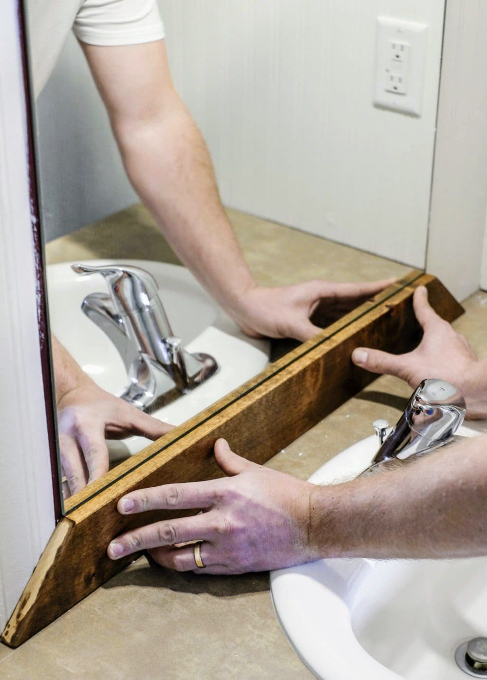 adding a diy wood frame to a bathroom mirror