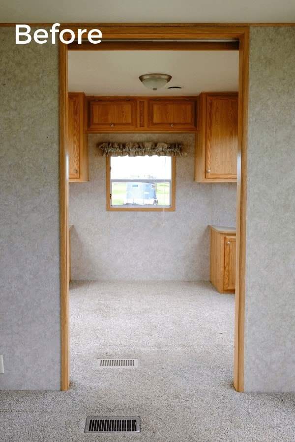 a RV window with valance and blinds 