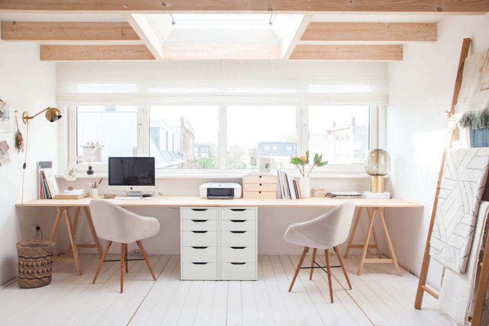 home office with large windows and simple decor