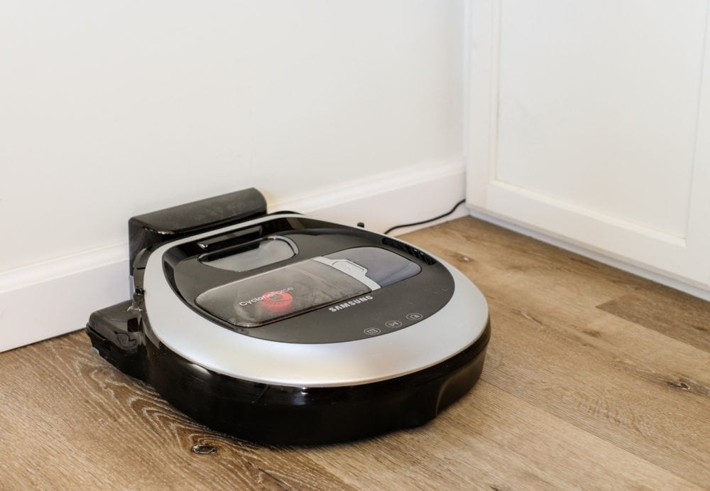 a Samsung POWERbot vacuum recharging at its docking station