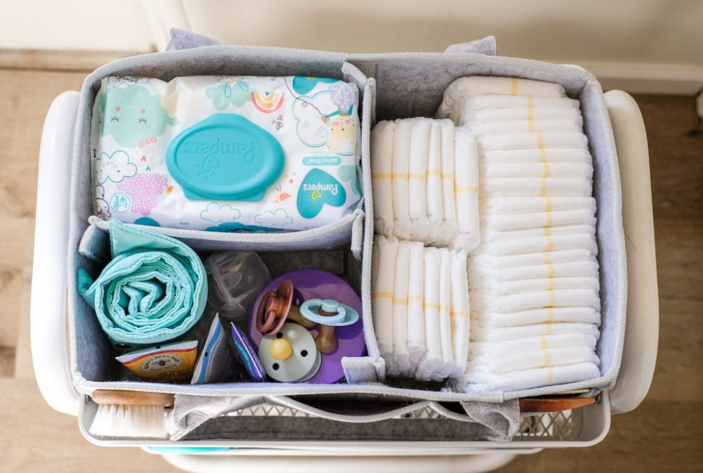 top shelf of a baby supplies three tier utility cart