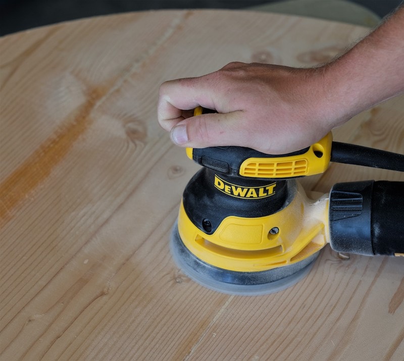 Sanding a tabletop with a Dewalt 5" sander