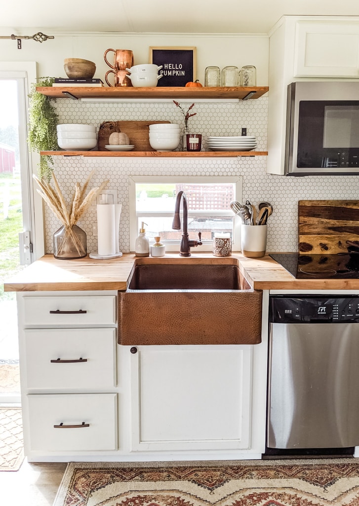 a kitchen decorated for fall