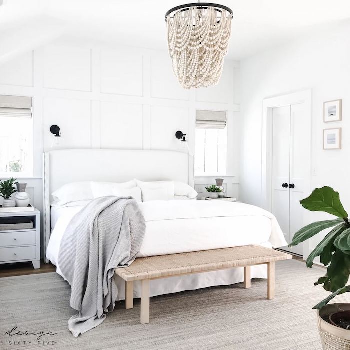 bedroom with a bench at the foot of the bed