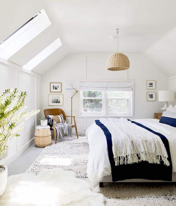 bedroom with layered rugs