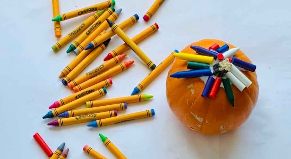 Using Crayons to paint pumpkins