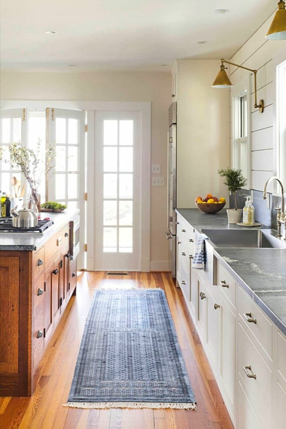 kitchen with two toned white and wood cabinets