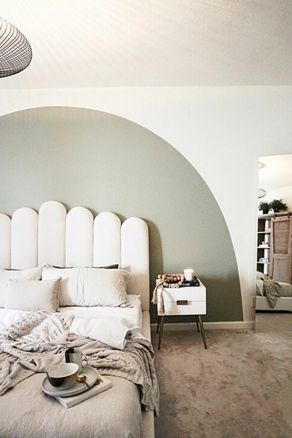 painted arch on wall behind behind bed and headboard