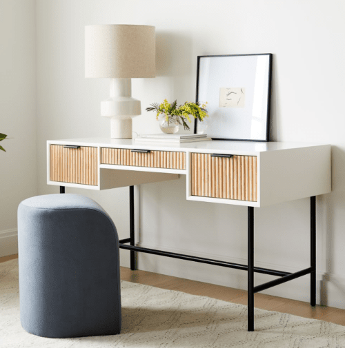 One of the best home office ideas is a desk that matches the decor in the rest of your home, like this white and wood desk