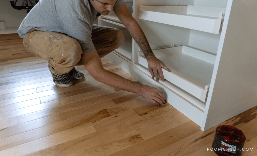 installing new floors and cabinetry 90s kitchen makeover