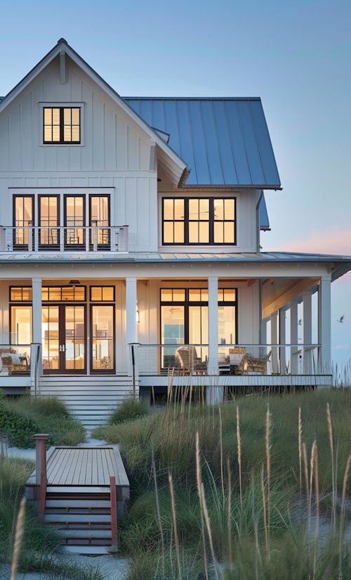 big coastal beachfront cottage at sunset