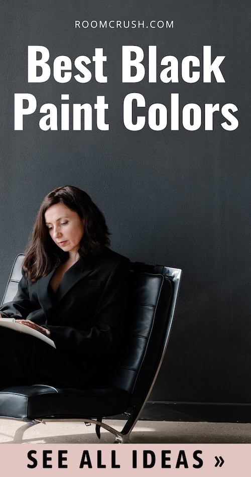 woman sits beside black wall, reading about the Best black paint colors: Ultimate guide