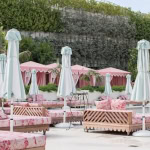 understanding the palm beach aesthetic - palm beach style rattan and pink patio funiture