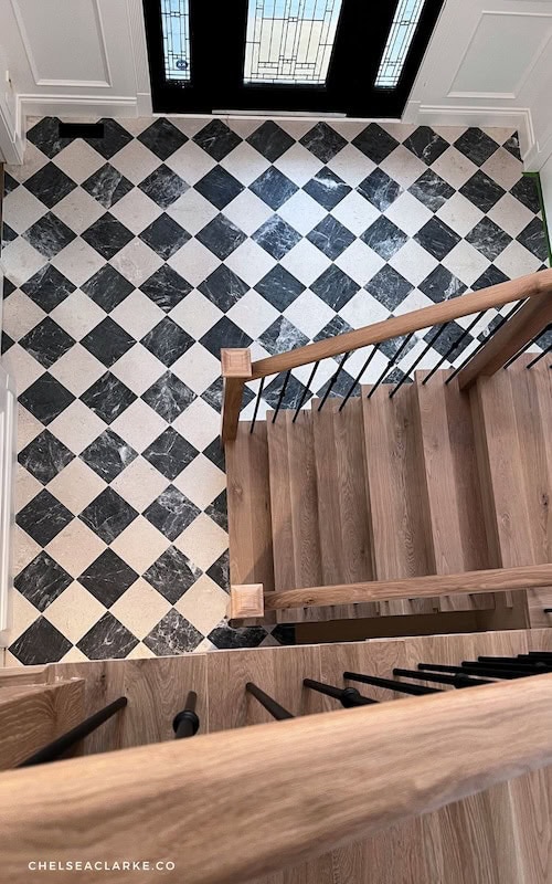 checkered floor harlequin tile floor entryway foyer stairs makeover